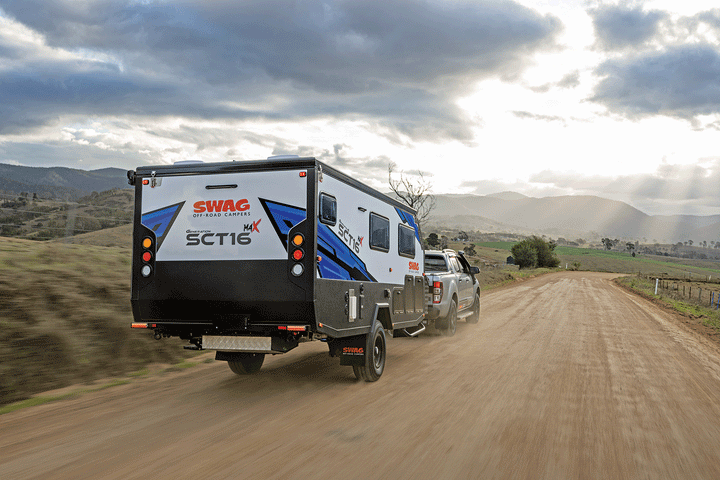 The Swag Gen 6 SCT16 hybrid driving along a dirt track